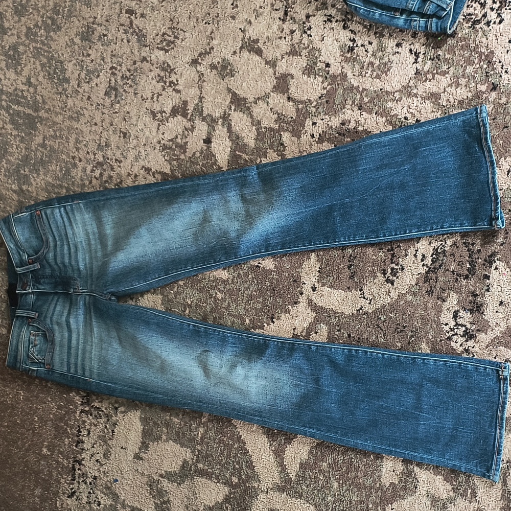 Buckle tailored bootcut jeans